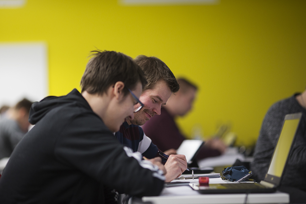 Students studying with laptop.