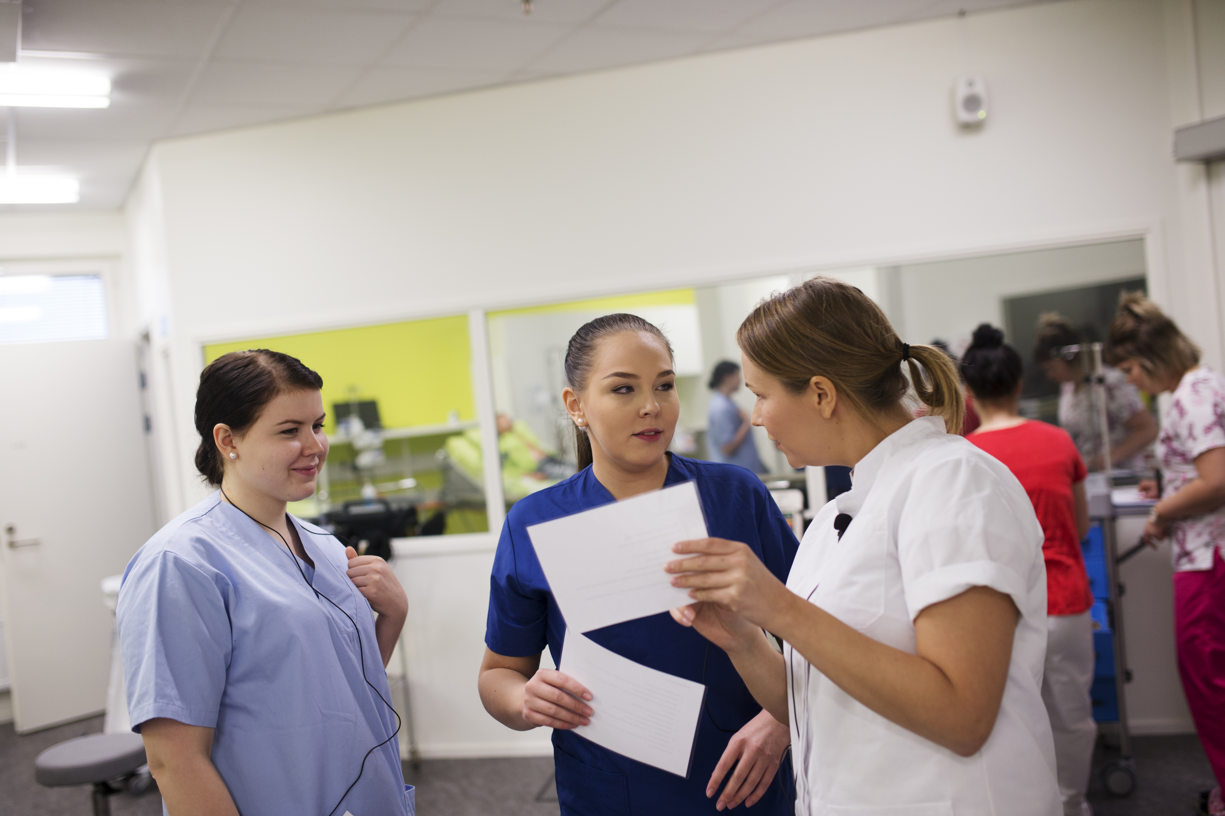 Nursing students in a simulation room.