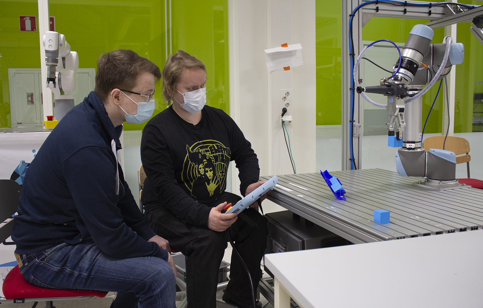In the picture, students are using a collaborative robot.