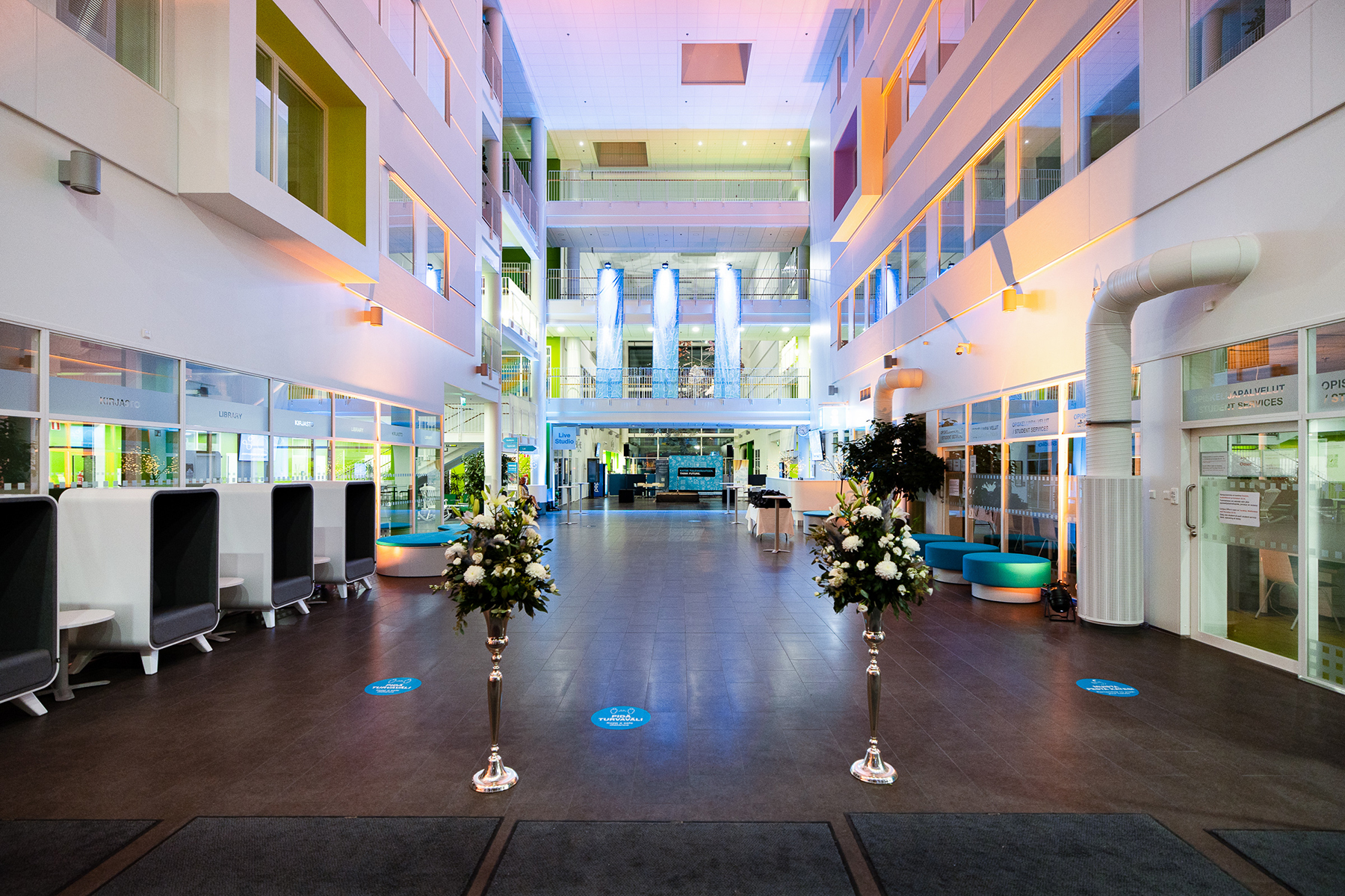 Flowers and festive lighting in the atrium lobby.