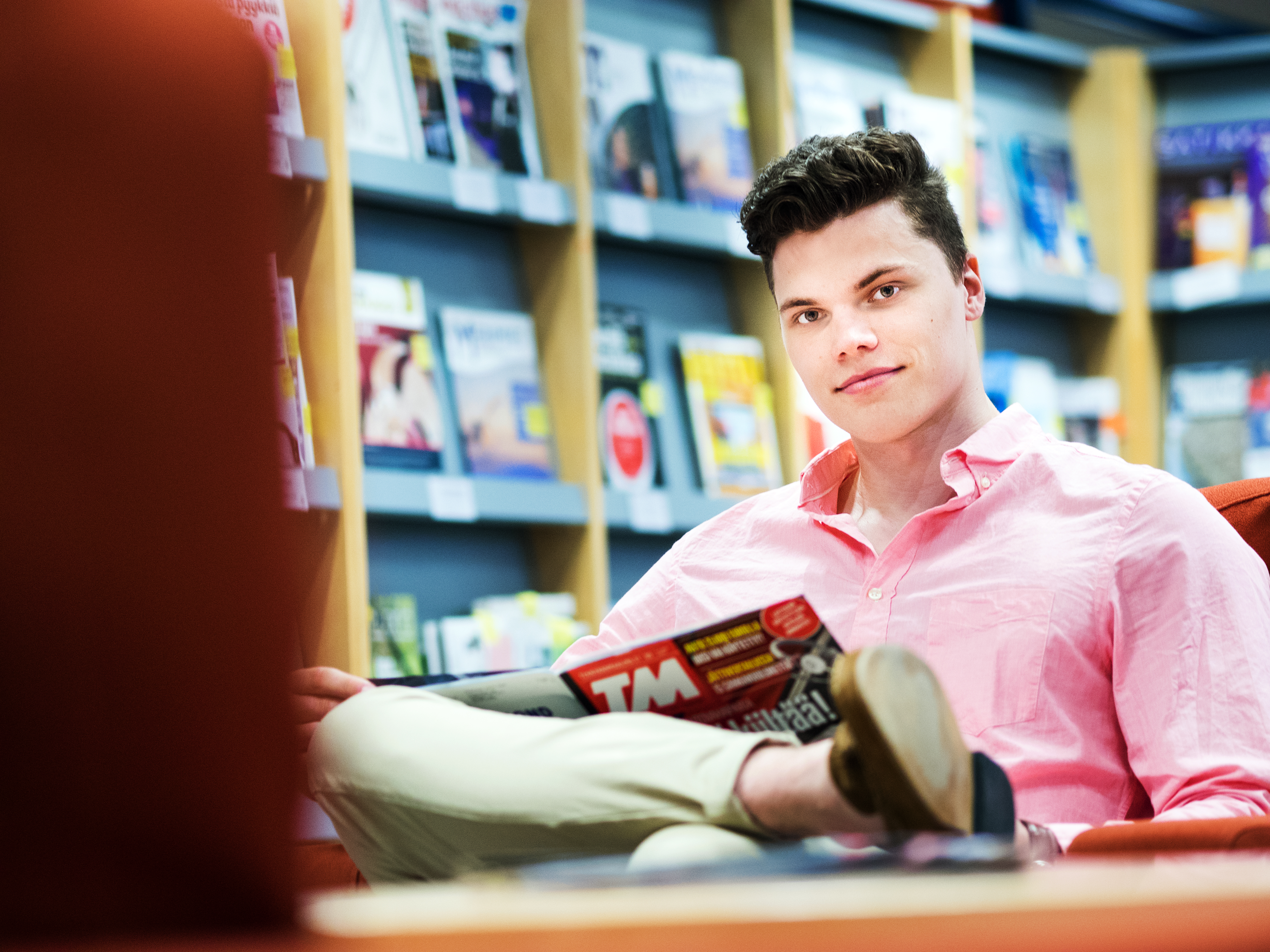 Person reading a magazine.
