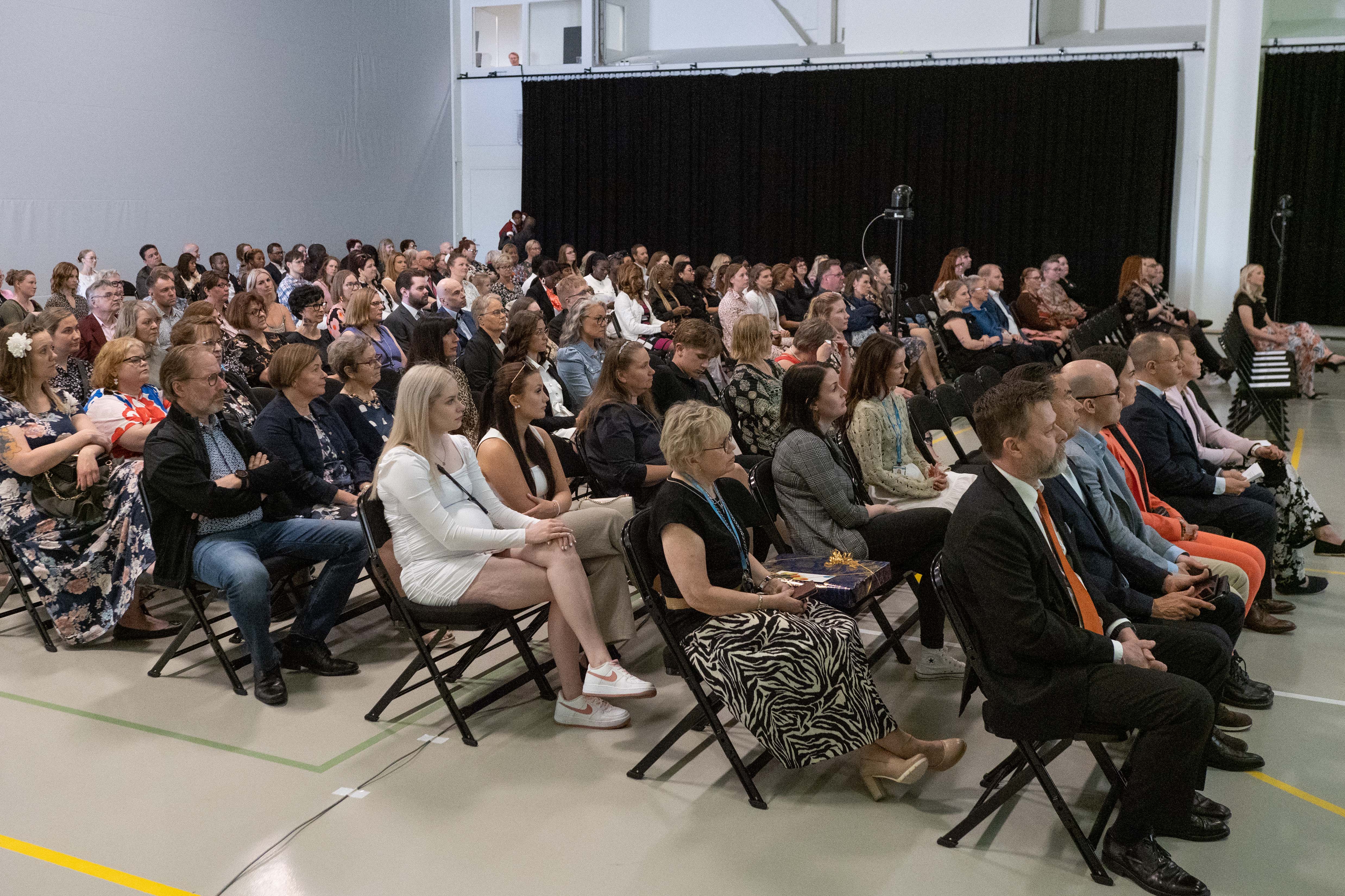 The audience of the event sitting at the Agora hall.