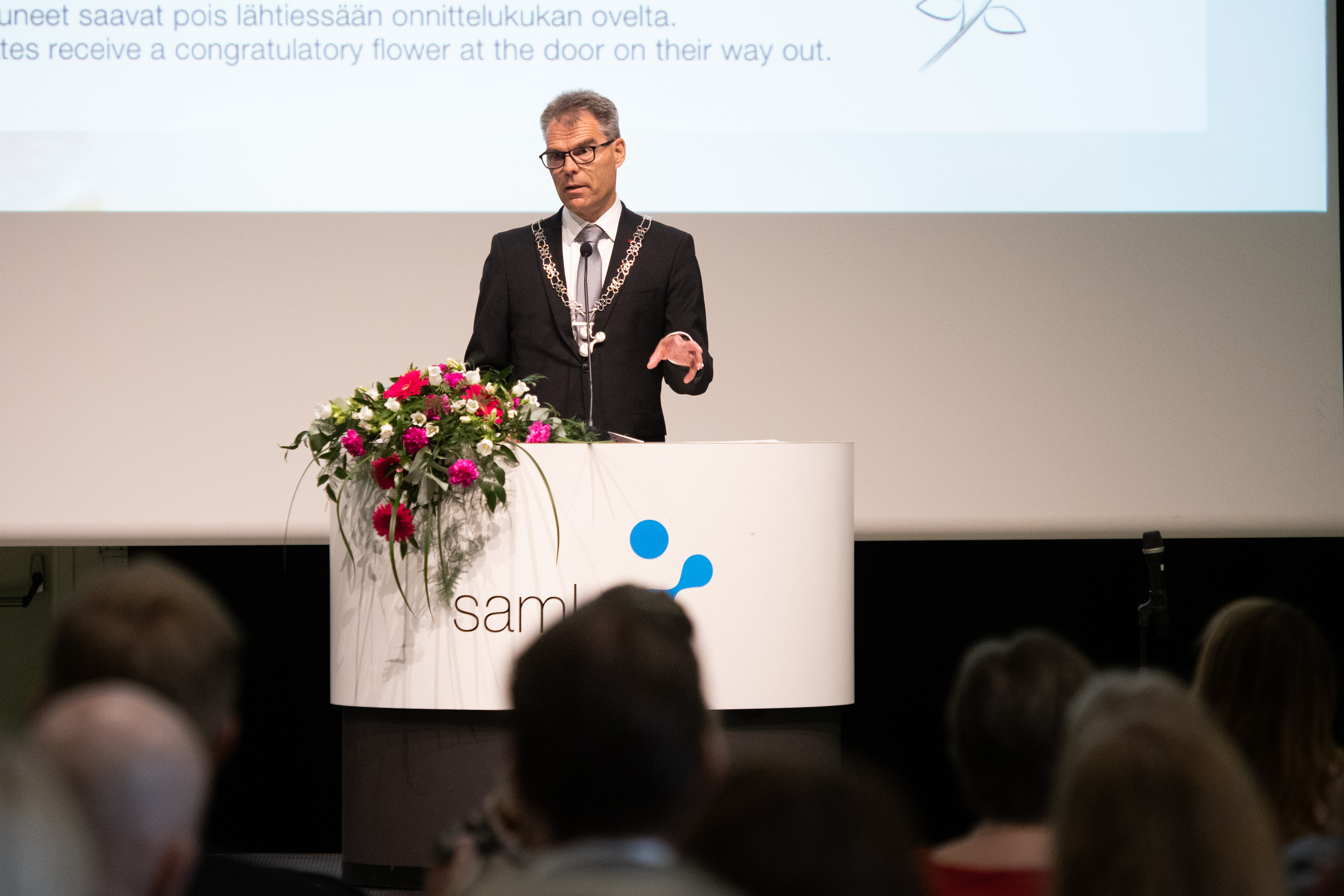 Rector Jari Multisilta speaks to the audience from a lectern.