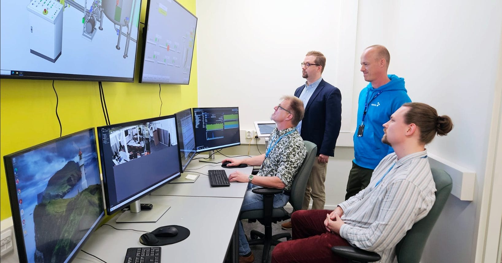 Companies gain concrete support from the cyber laboratory in multiple ways. Pictured from left: Head of Teaching Jussi Törmänen, Senior Lecturer Jere Grönman, Senior Lecturer Kimmo Viitala and Laboratory Engineer Marko Jalonen.