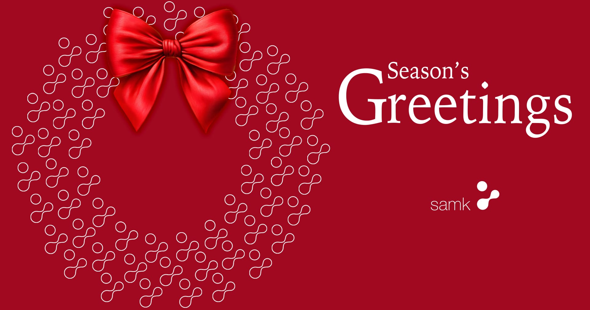 It reads “Season’s Greetings” on a red background.